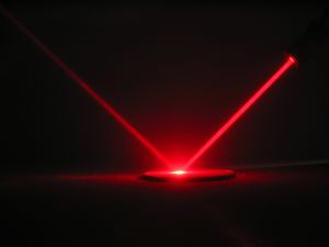 An invisible laser beam to listen from a distance, even behind a glass